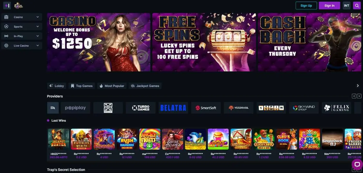 Trap Casino homepage screenshot showing welcome bonus, free spins, cashback promos and game providers